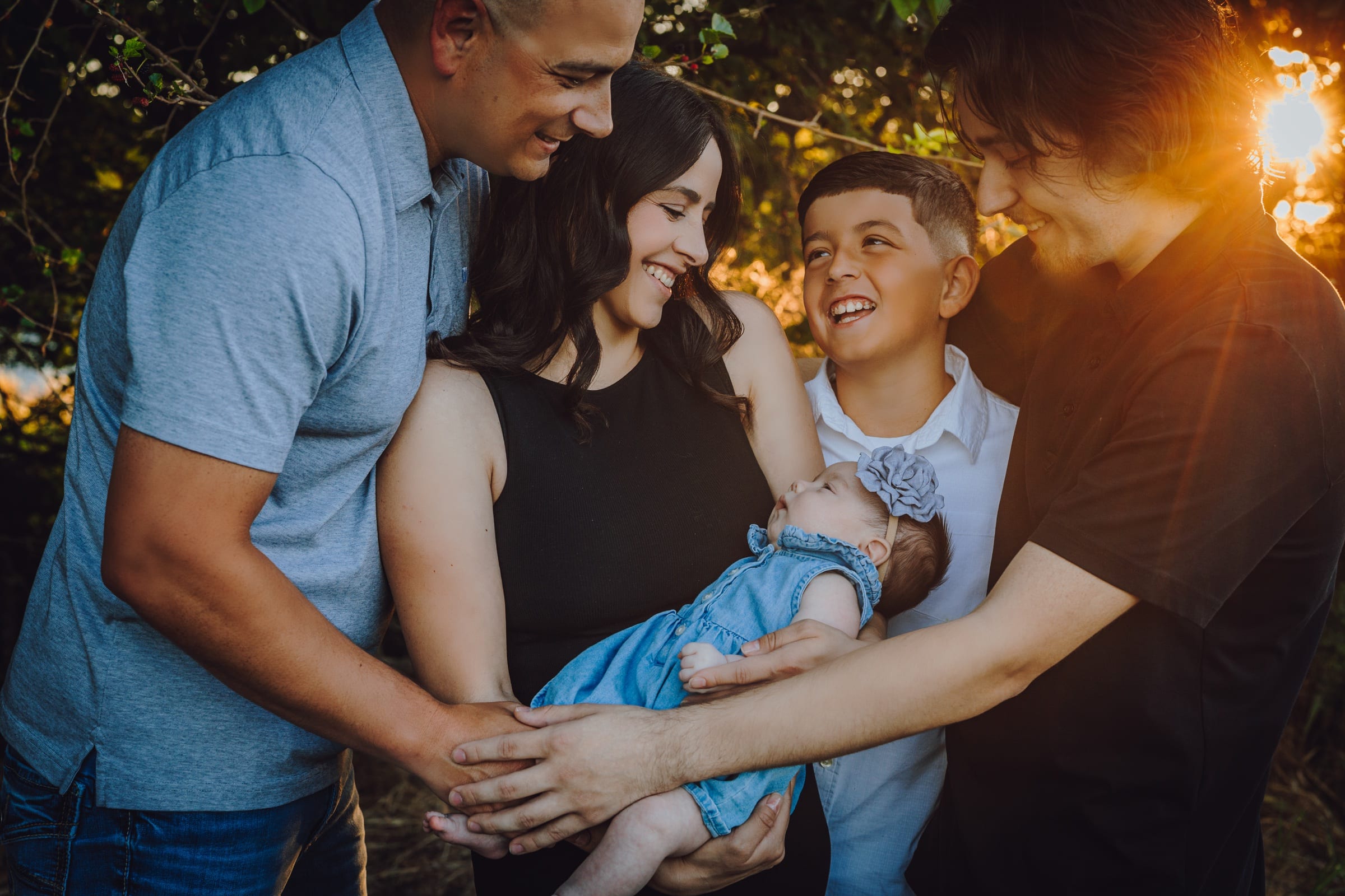 Family gathered together in warm evening light